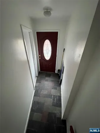 a view of a car park in front of a house