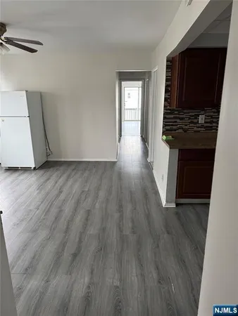 a view of room with window and hardwood floor