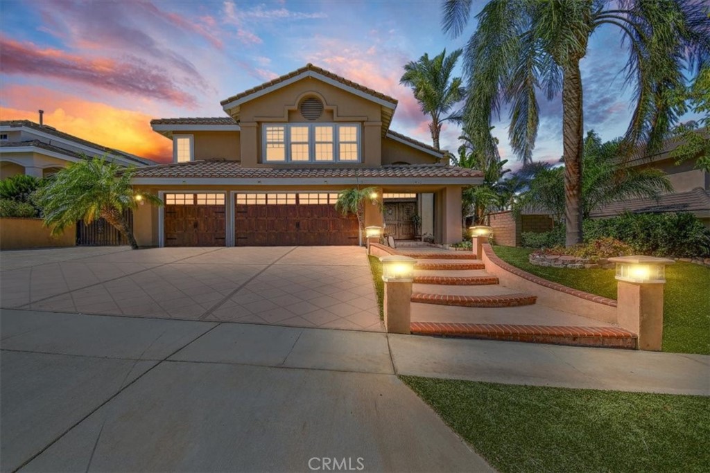 1460 Dominguez Ranch Road Corona, CA 92882 - Photo 1 of 1 a front view of a house with a yard