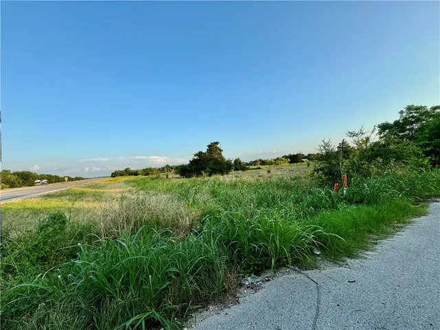 a view of a lake with a yard