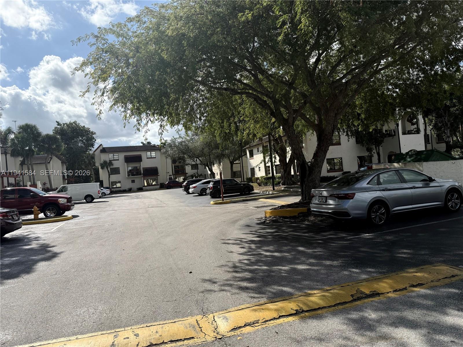 8620 Southwest 149th Avenue, Unit 416 Miami, FL 33193 - Photo 2 of 21 a view of street with parked cars