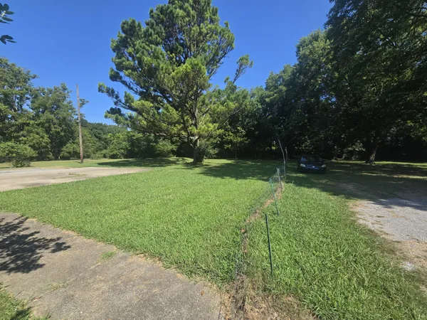 a view of outdoor space with deck and yard