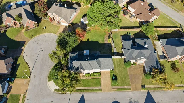 an aerial view of a house with a swimming pool
