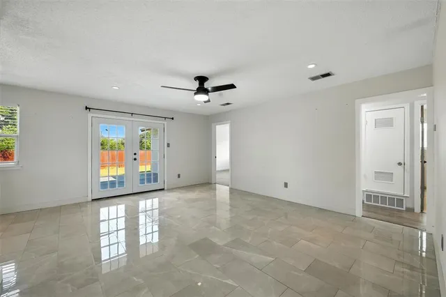 a view of an empty room with a window