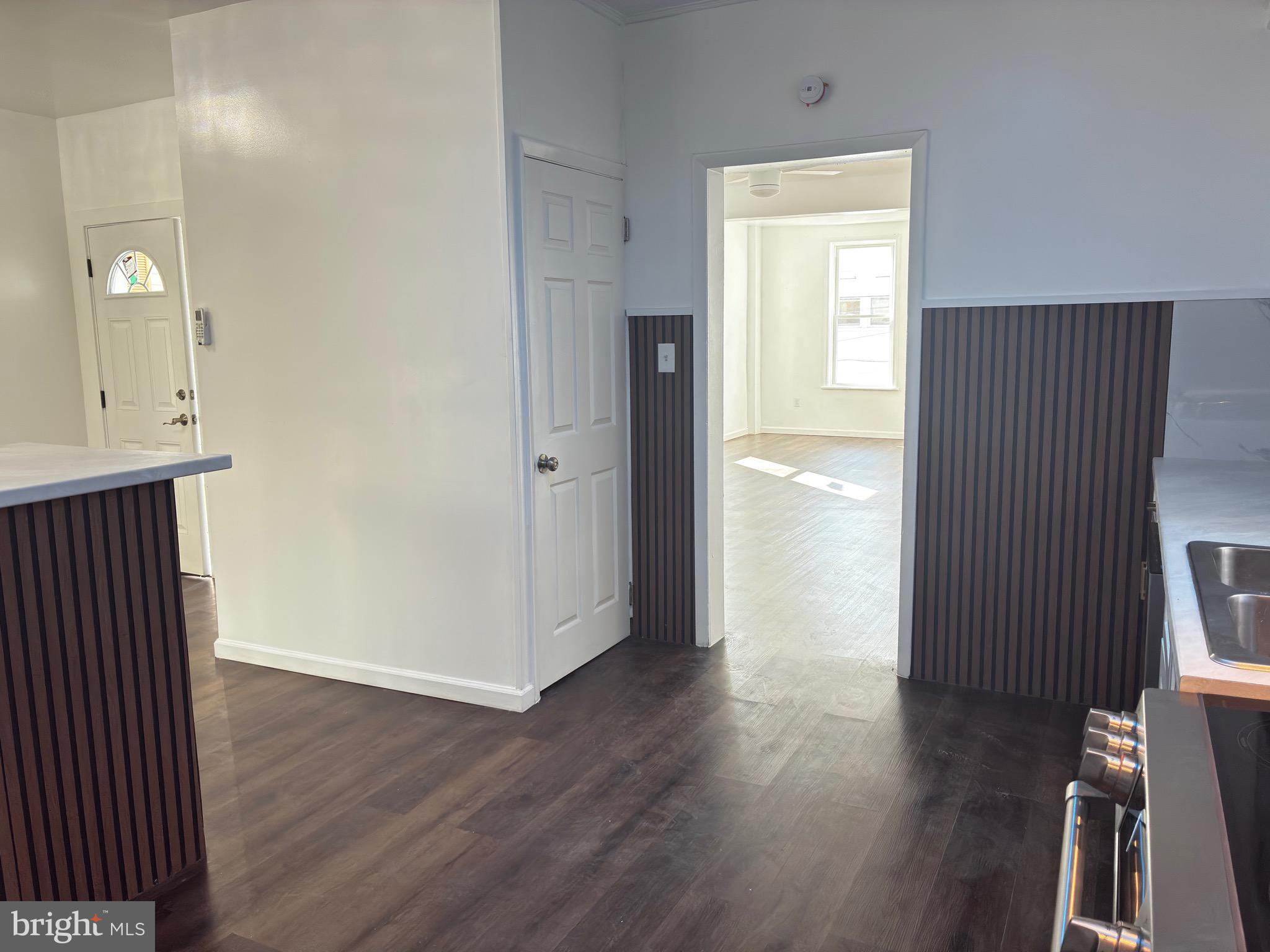 41 South 2nd Street Steelton, PA 17113 - Photo 11 of 24 an empty room with wooden floor and a fireplace