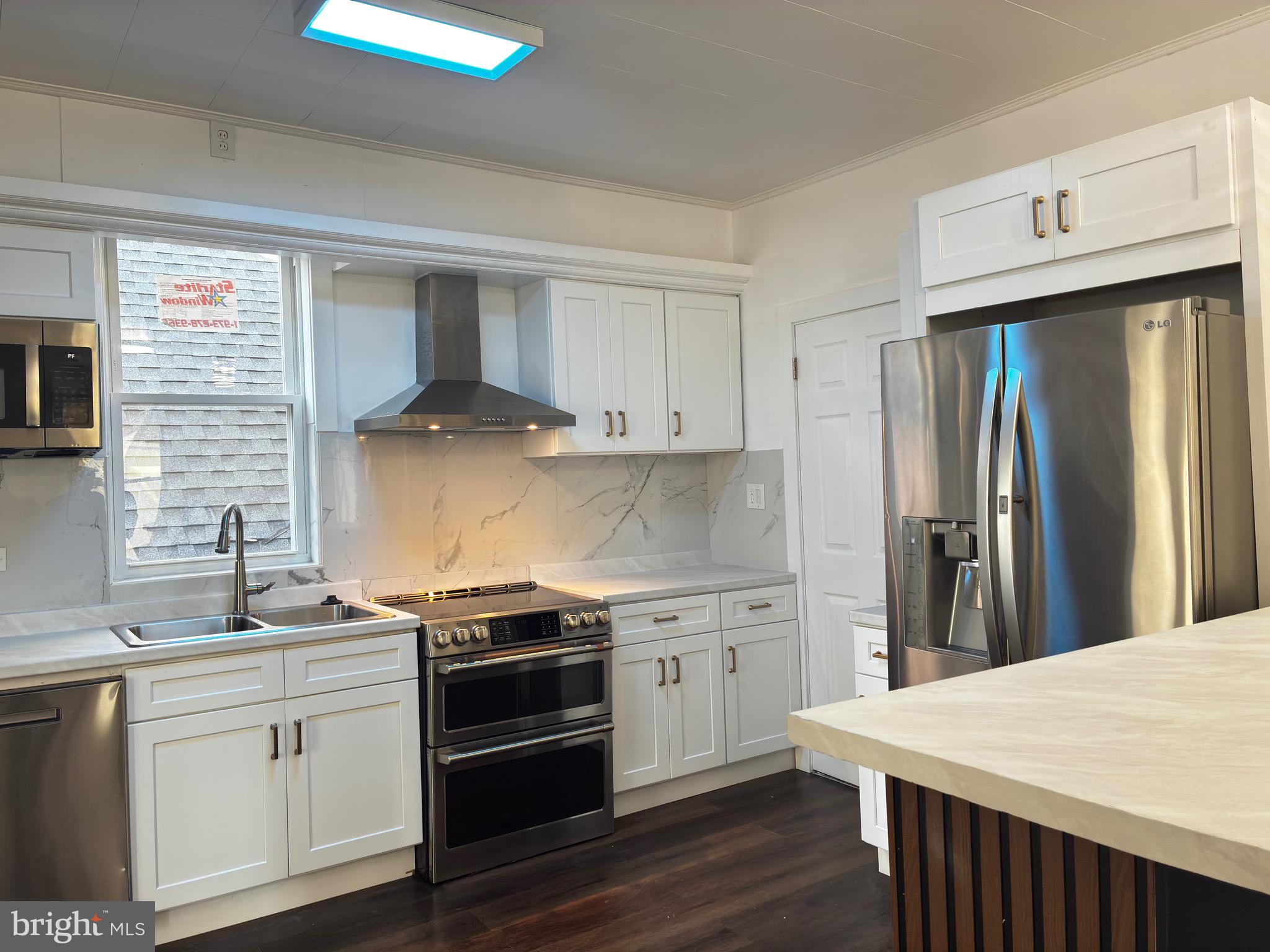 41 South 2nd Street Steelton, PA 17113 - Photo 12 of 24 a kitchen with a stove and a refrigerator