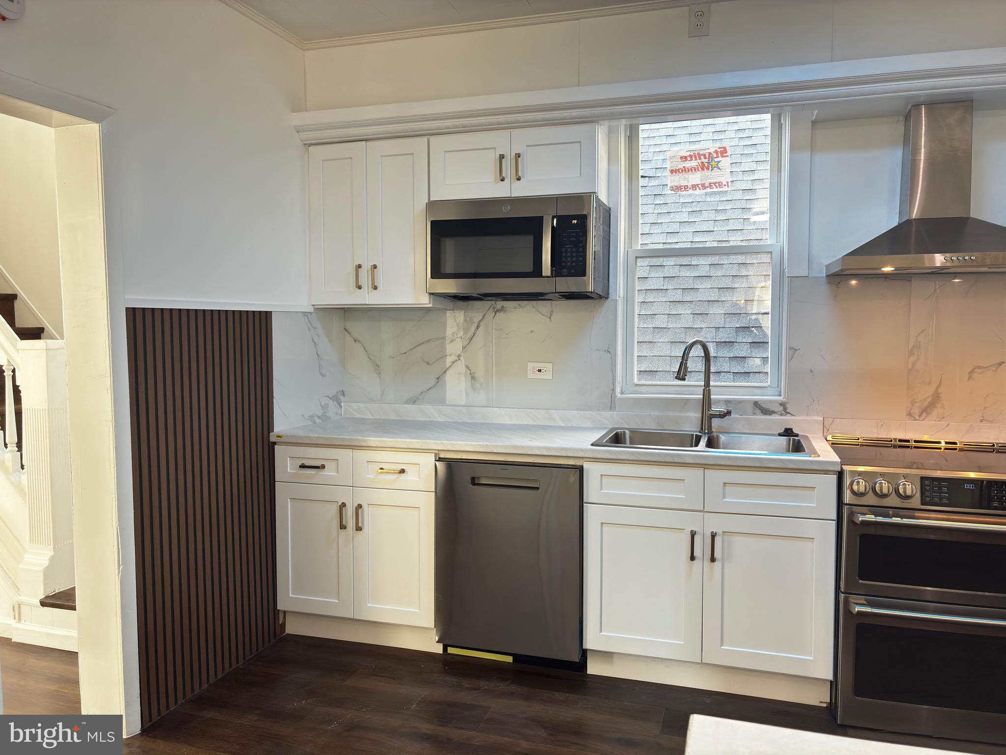 41 South 2nd Street Steelton, PA 17113 - Photo 13 of 24 a kitchen with stainless steel appliances a sink stove and cabinets