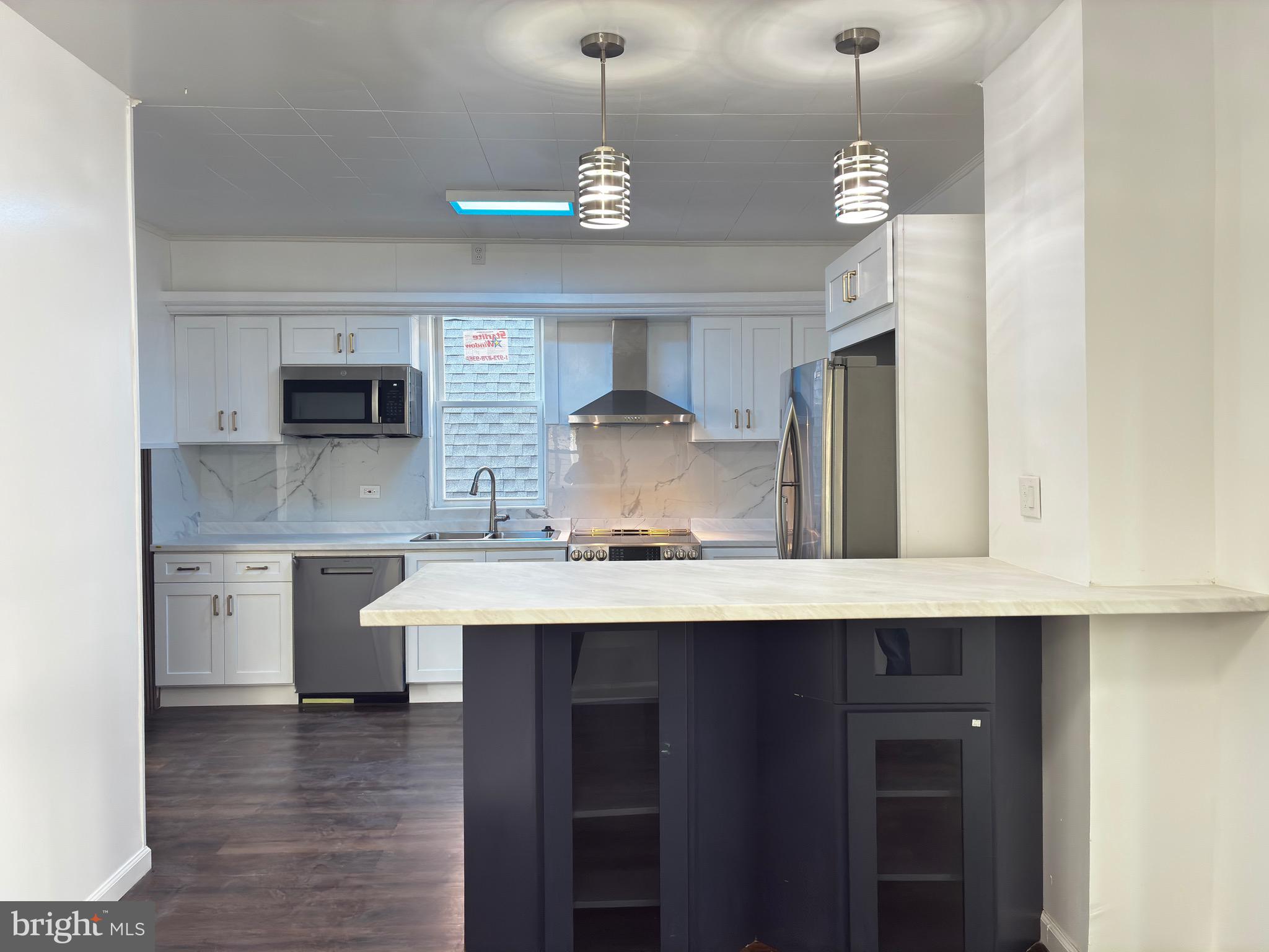 41 South 2nd Street Steelton, PA 17113 - Photo 15 of 24 a kitchen with stainless steel appliances a sink stove and refrigerator