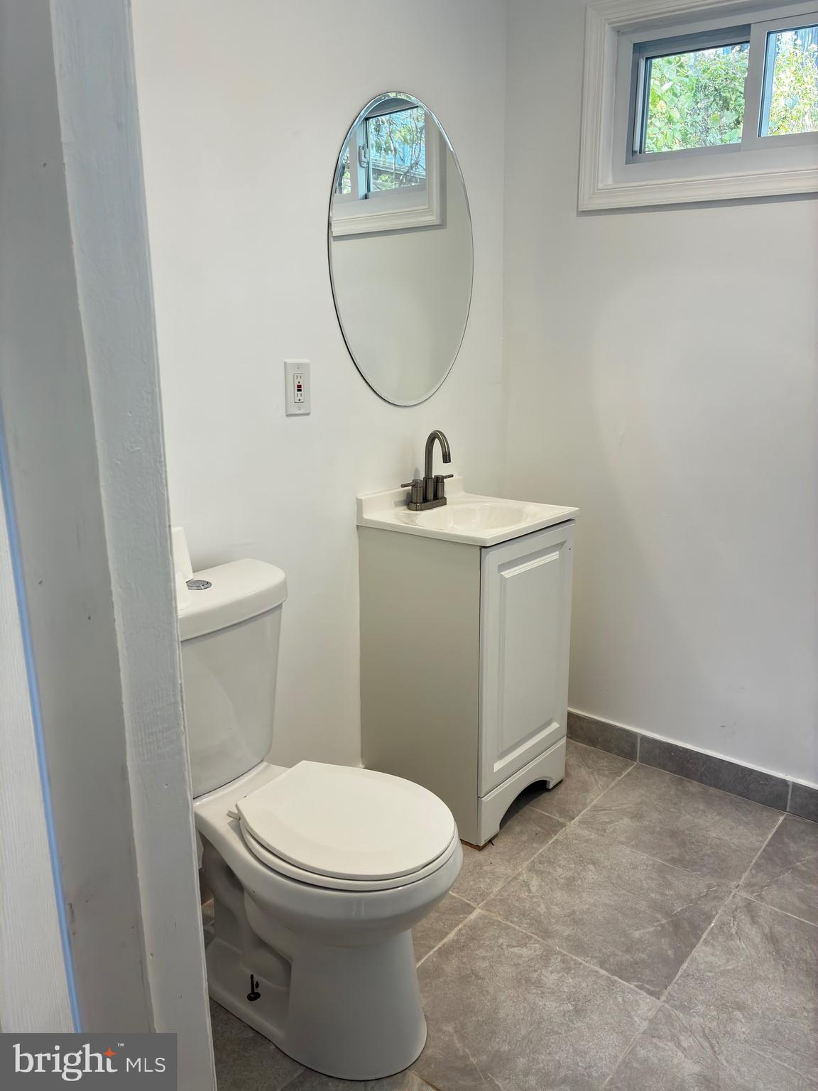 41 South 2nd Street Steelton, PA 17113 - Photo 17 of 24 a bathroom with a toilet a sink and mirror