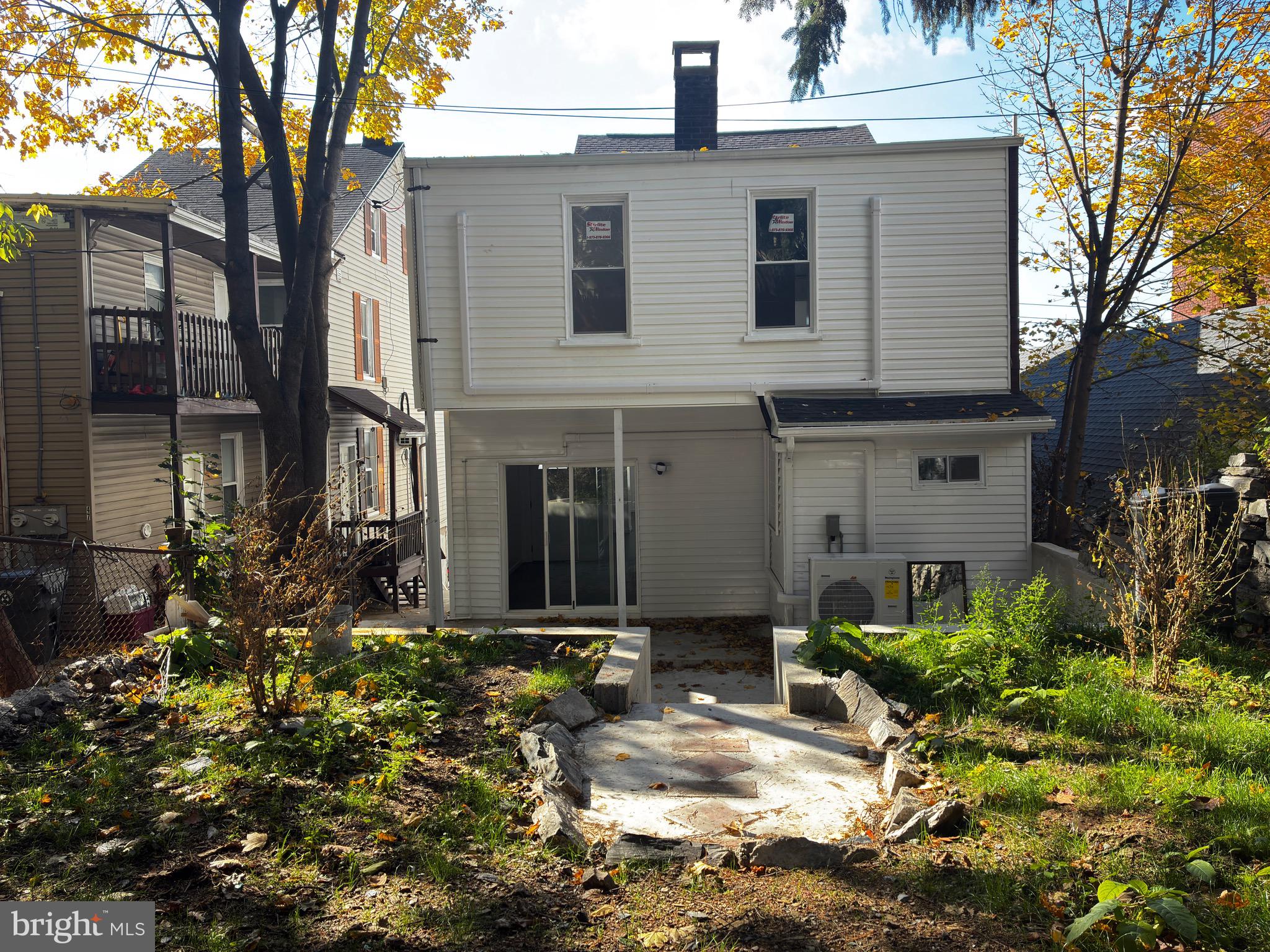 41 South 2nd Street Steelton, PA 17113 - Photo 21 of 24 a front view of a house with a yard and potted plants