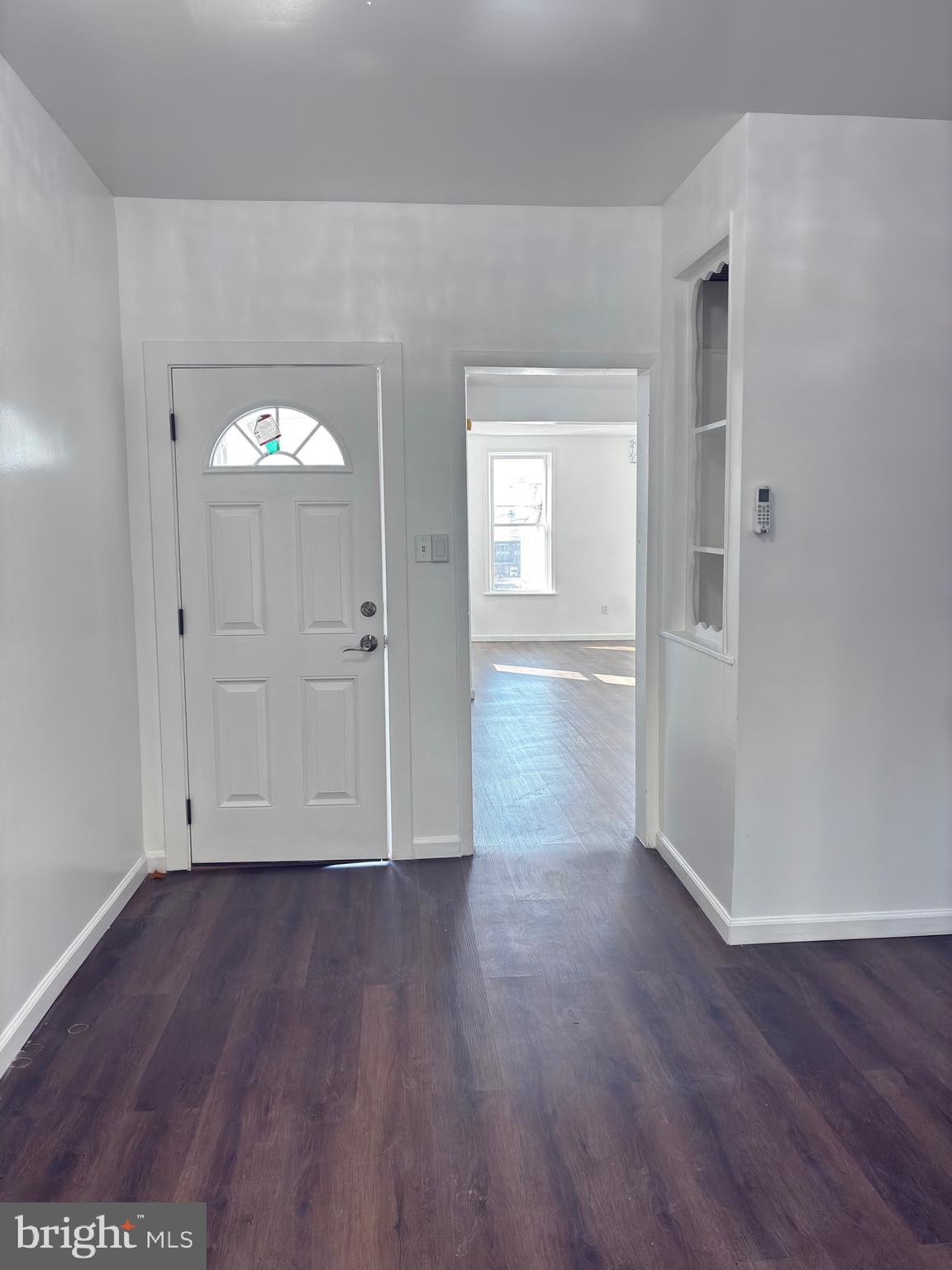 41 South 2nd Street Steelton, PA 17113 - Photo 7 of 24 an empty room with wooden floor and mirror