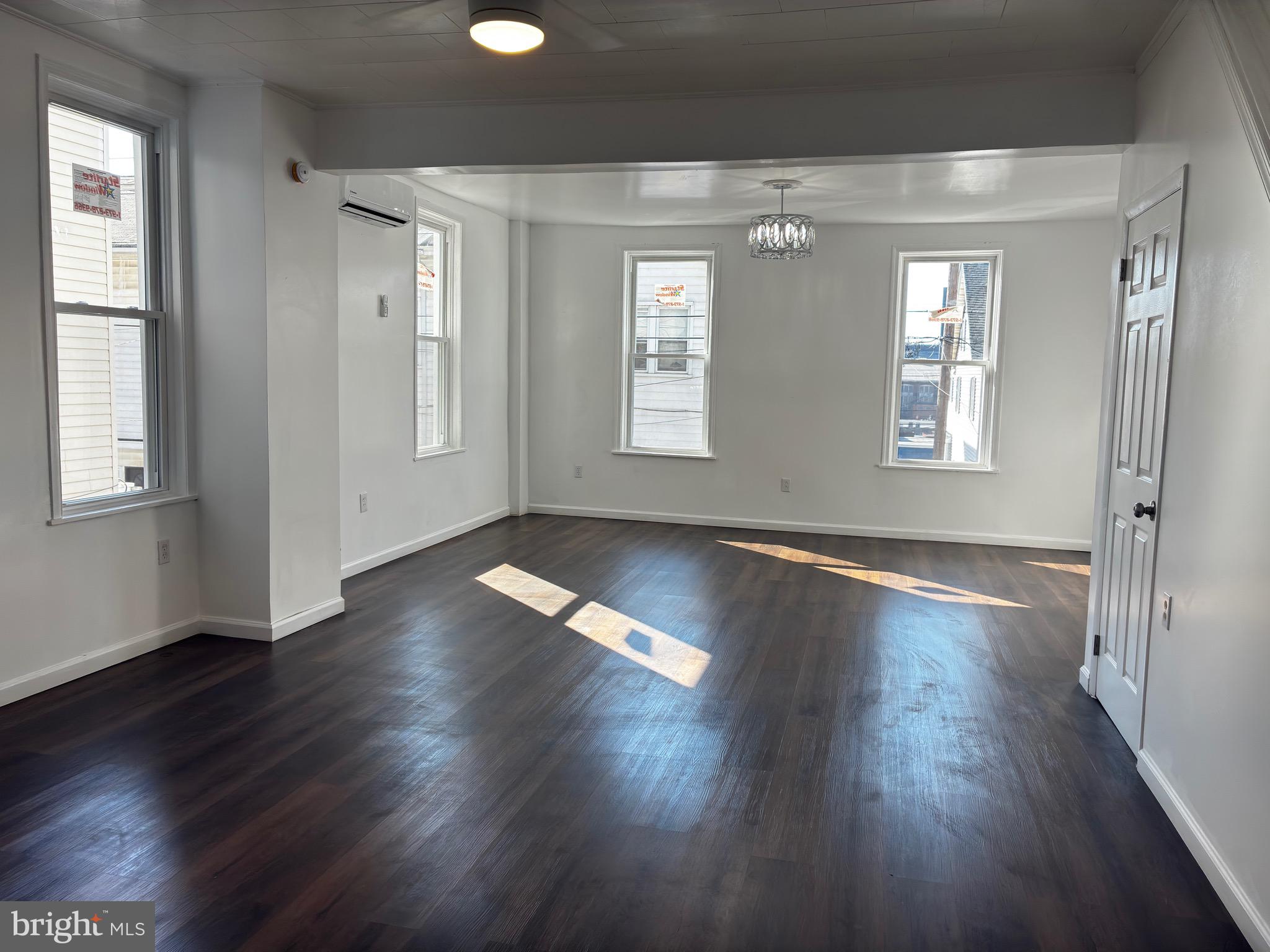 41 South 2nd Street Steelton, PA 17113 - Photo 8 of 24 an empty room with wooden floor and windows