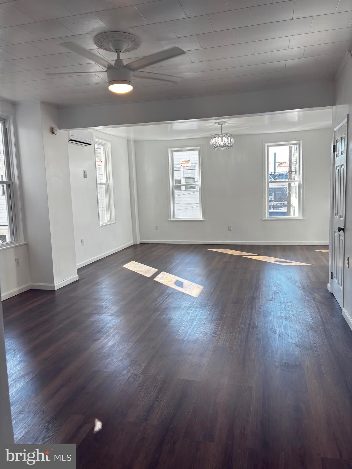 41 South 2nd Street Steelton, PA 17113 - Photo 9 of 24 a view of an empty room with wooden floor and a window