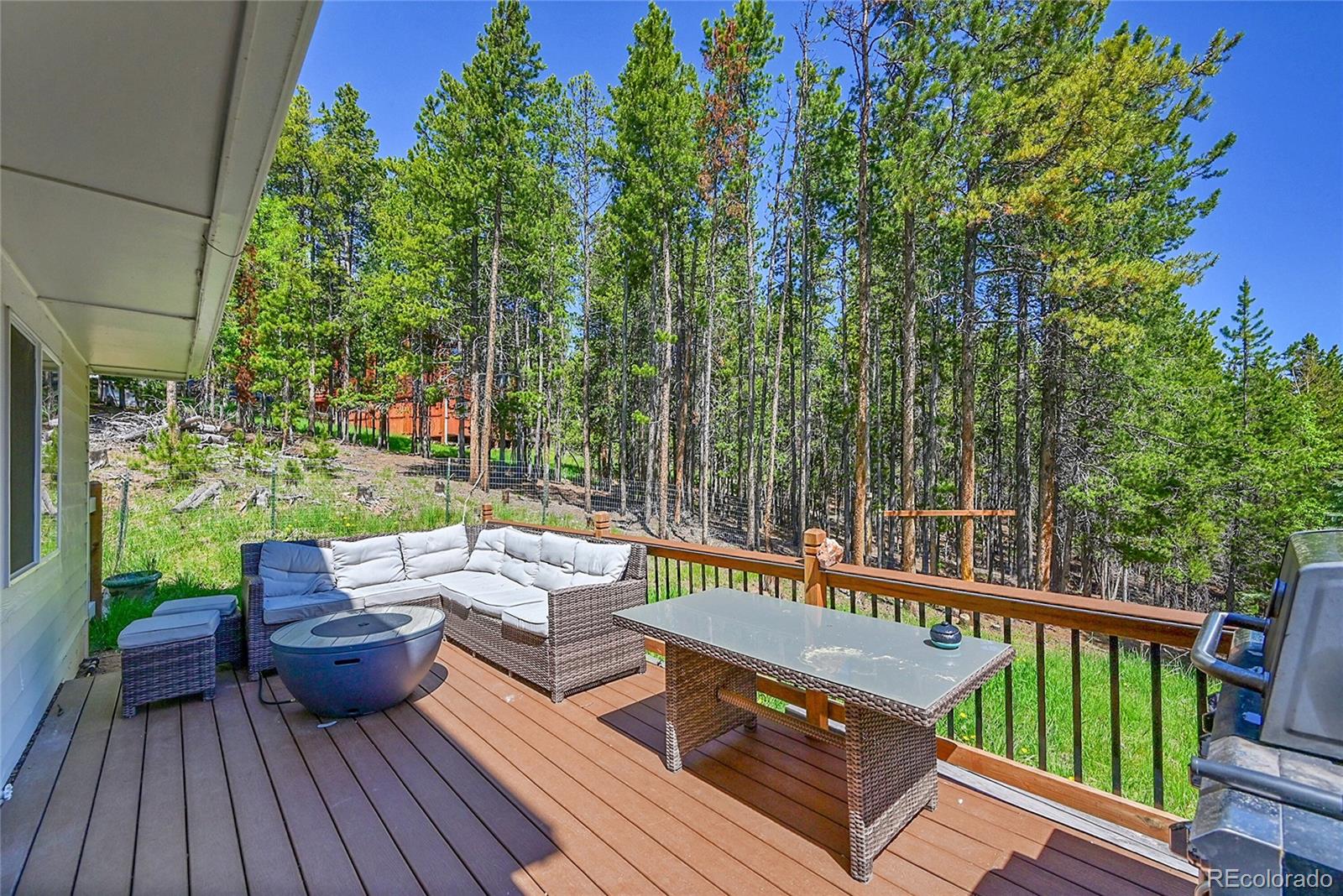 9092 South Gray Lane Conifer, CO 80433 - Photo 19 of 23 a view of a wooden deck with furniture