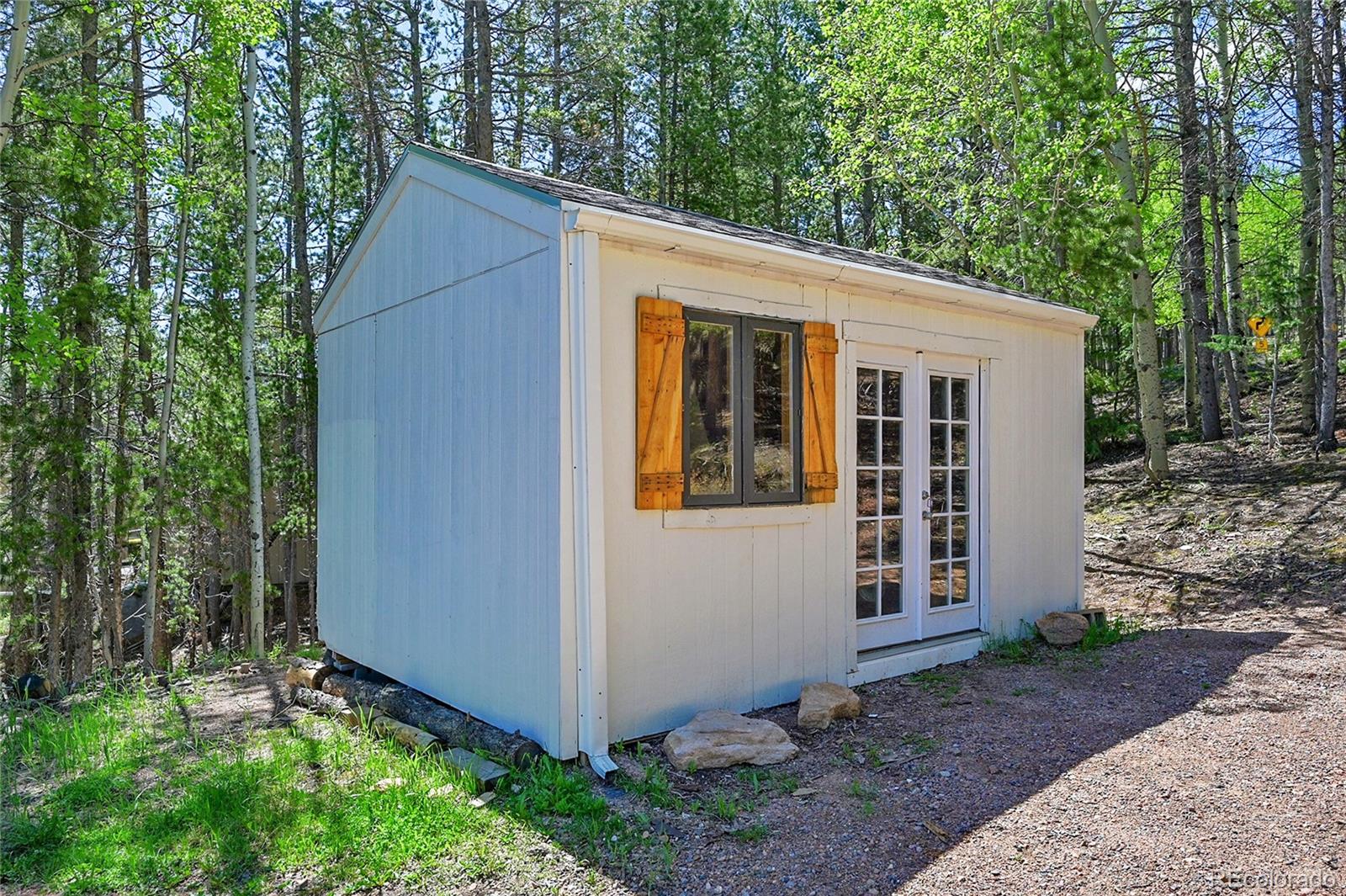 9092 South Gray Lane Conifer, CO 80433 - Photo 23 of 23 a view of a backyard with plants