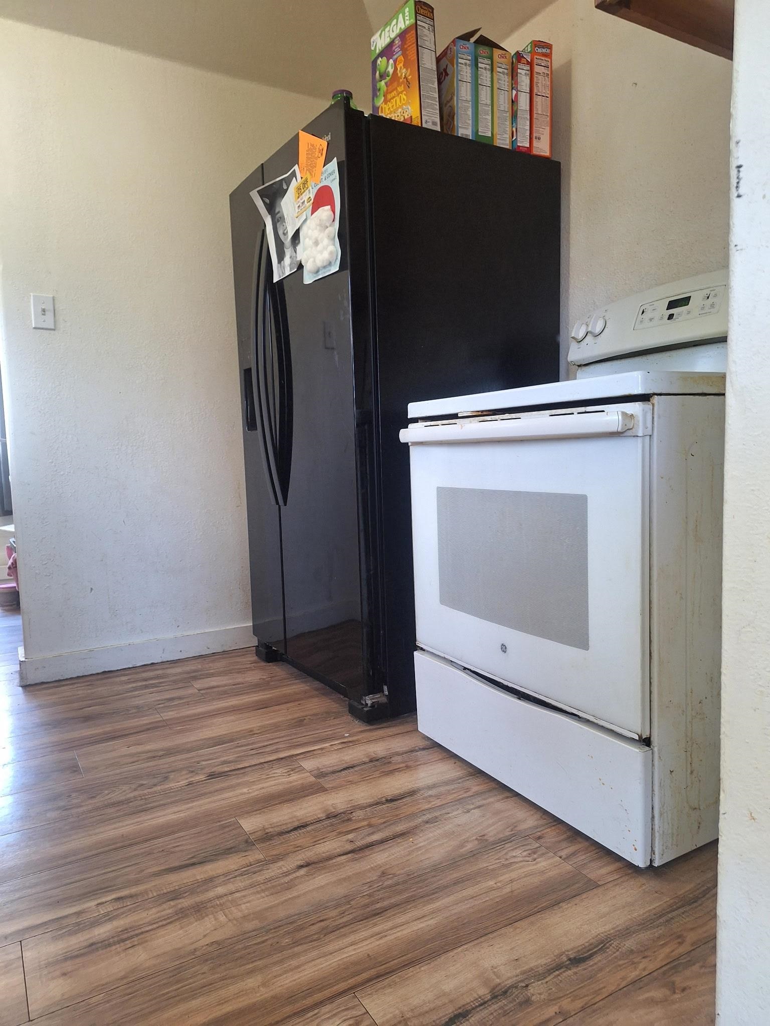 805 B Street Delta, CO 81416 - Photo 12 of 20 a view of an empty room with wooden floor and a cabinet