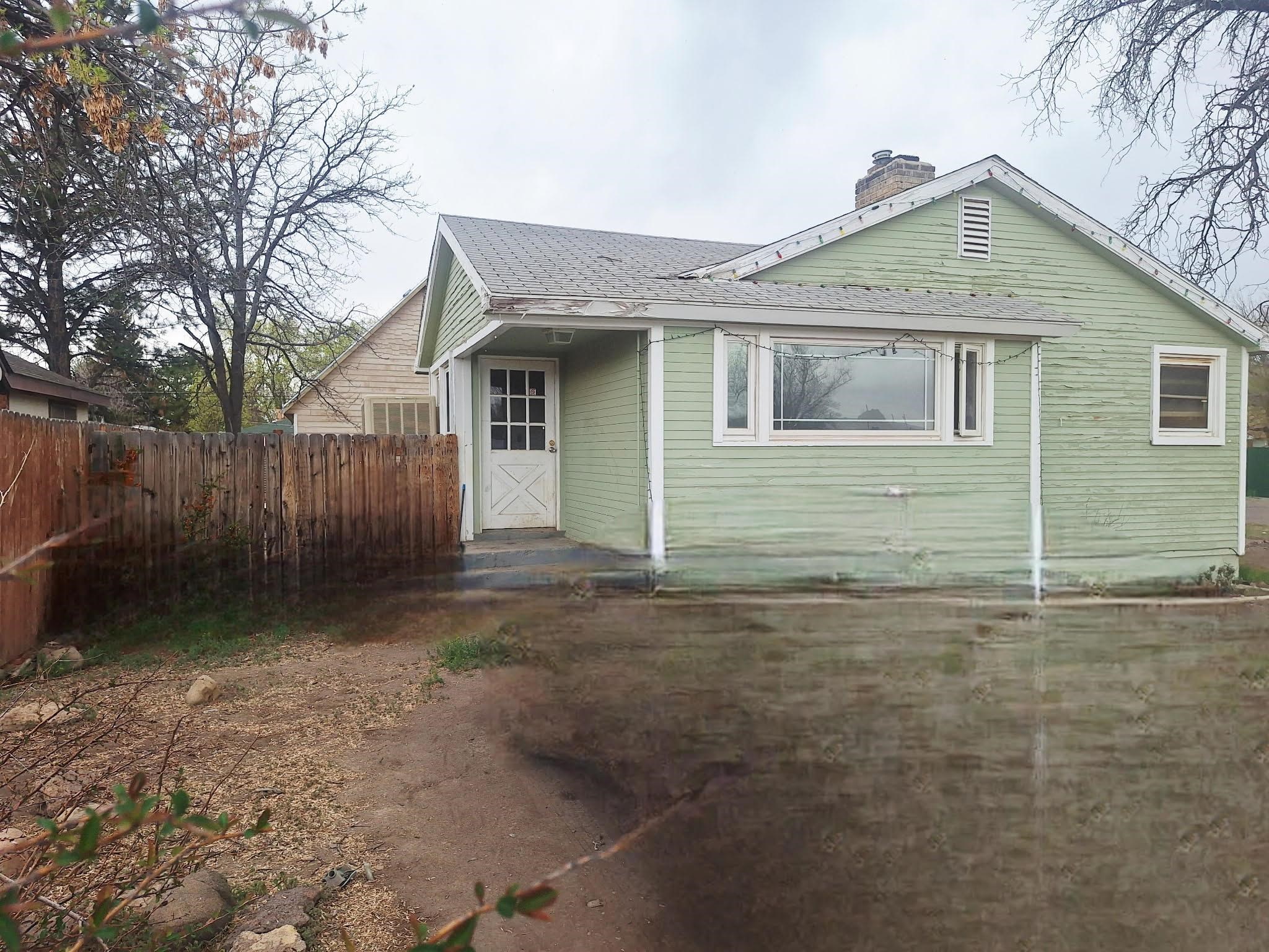 805 B Street Delta, CO 81416 - Photo 2 of 20 a front view of a house with garden
