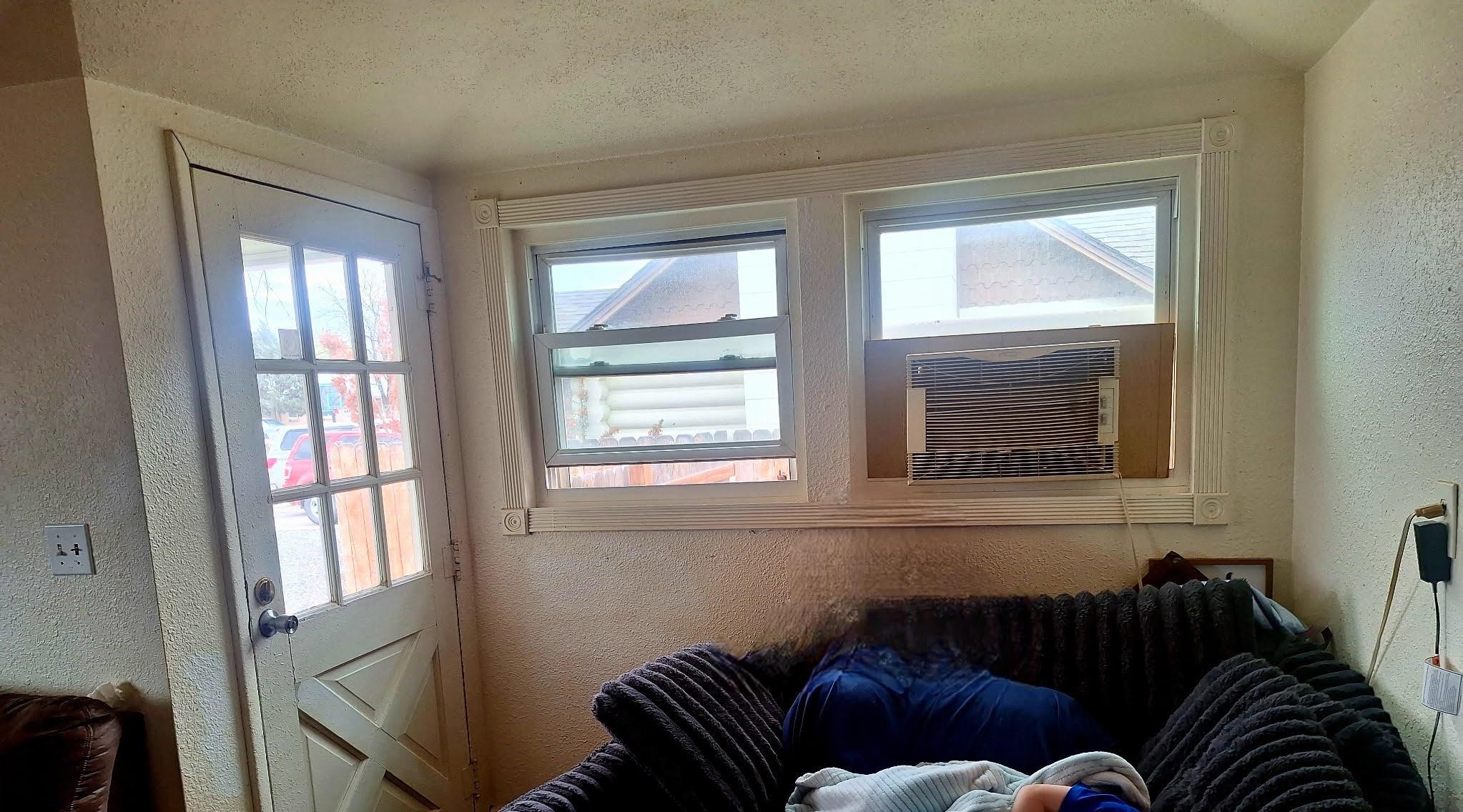 805 B Street Delta, CO 81416 - Photo 8 of 20 a living room with furniture and a window