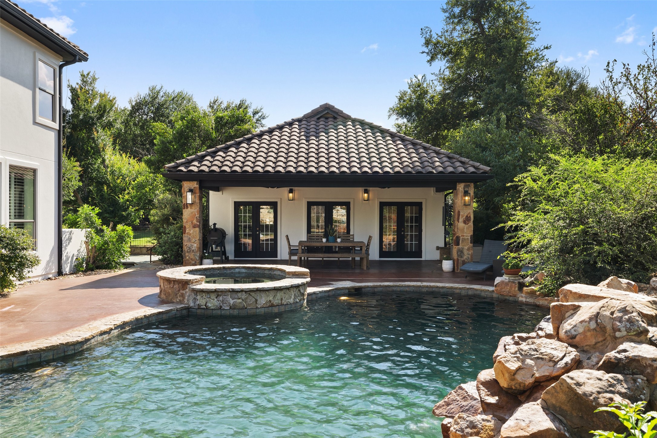 15713 Spillman Ranch Loop Austin, TX 78738 - Photo 29 of 40 The casita provides flexibility as a pool house or guest house with a spacious 2nd covered patio space.