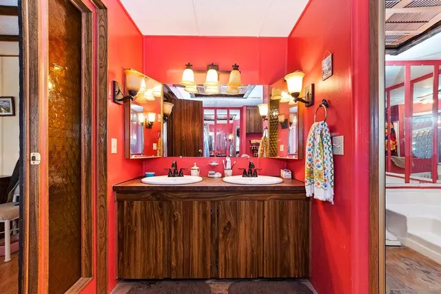 a bathroom with a sink and a mirror