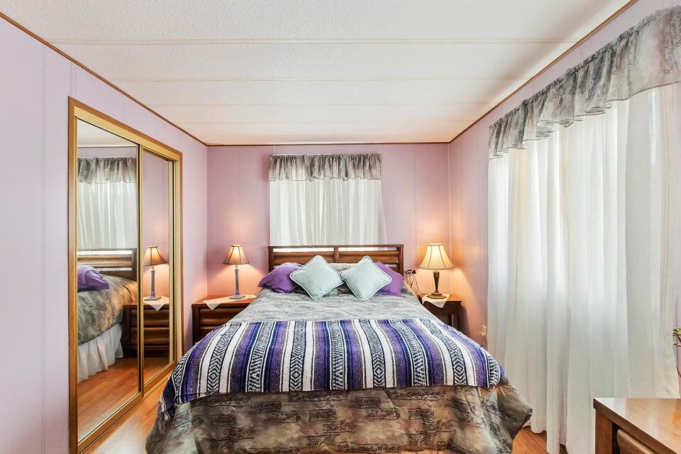 74711 Dillon Road, Unit 308 Desert Hot Springs, CA 92241 - Photo 19 of 42 a bedroom with a bed and a window