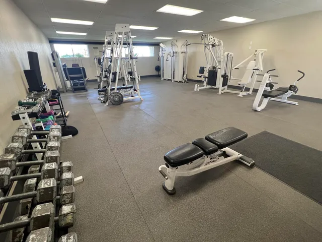 a room with gym equipment and equipment