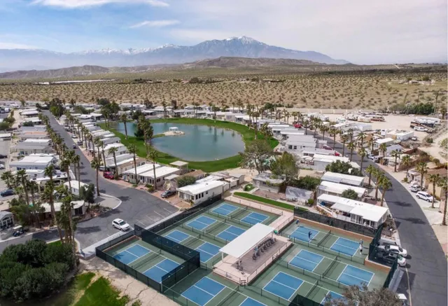 a view of a lake with a house in the background