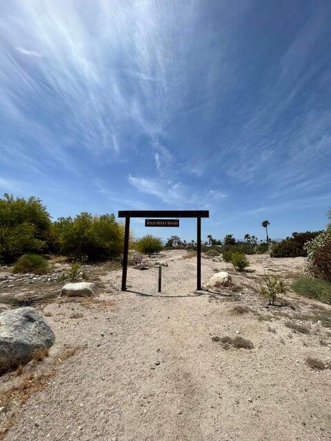 74711 Dillon Road, Unit 308 Desert Hot Springs, CA 92241 - Photo 40 of 42 a view of a bench with some trees in the background