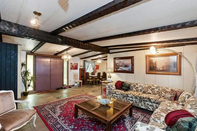 a living room with furniture and window