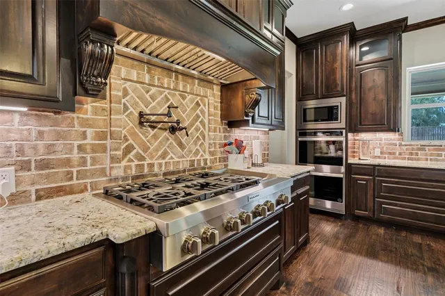 a kitchen with a stove and a microwave