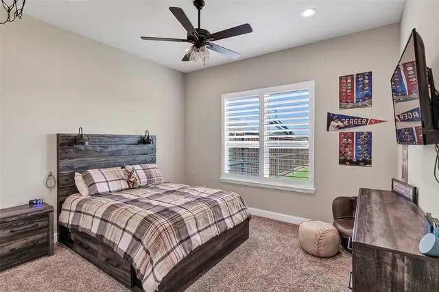 a bedroom with a bed couch and window