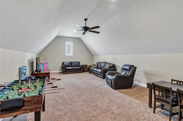 a living room with furniture a air conditioner vent and a window