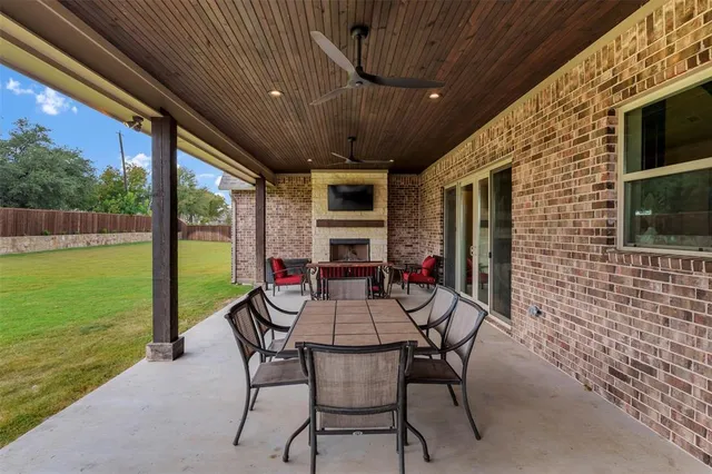 a dining room with furniture and garden view