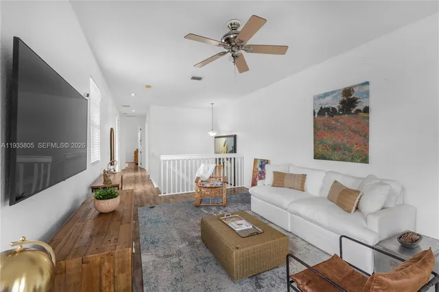 a view of a palm plant from a balcony