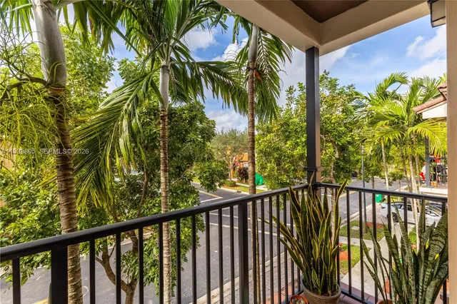 a view of a balcony with a tree