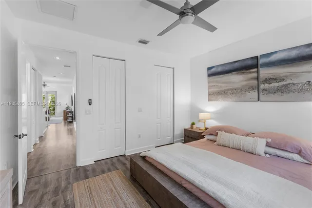 a bathroom with double sink and a mirror