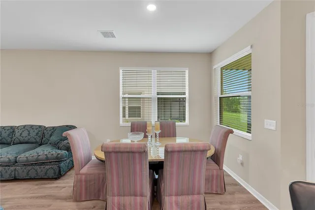 a view of a dining room with furniture window and outside view