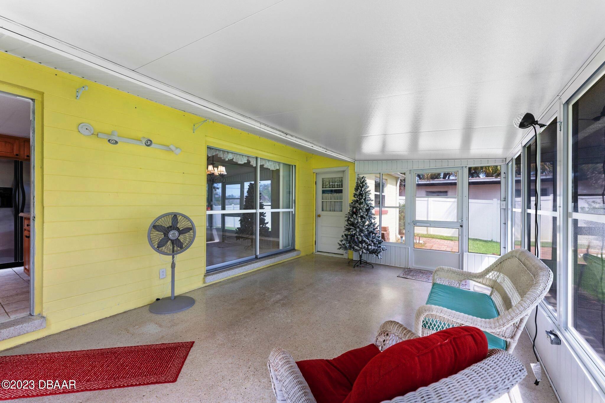 997 Parkwood Drive Ormond Beach, FL 32174 - Photo 11 of 25 997 Parkwood enclosed florida room