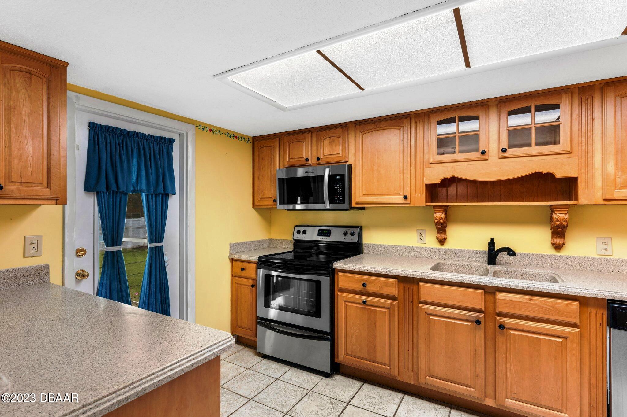 997 Parkwood Drive Ormond Beach, FL 32174 - Photo 2 of 25 997 Parkwood kitchen stove sink