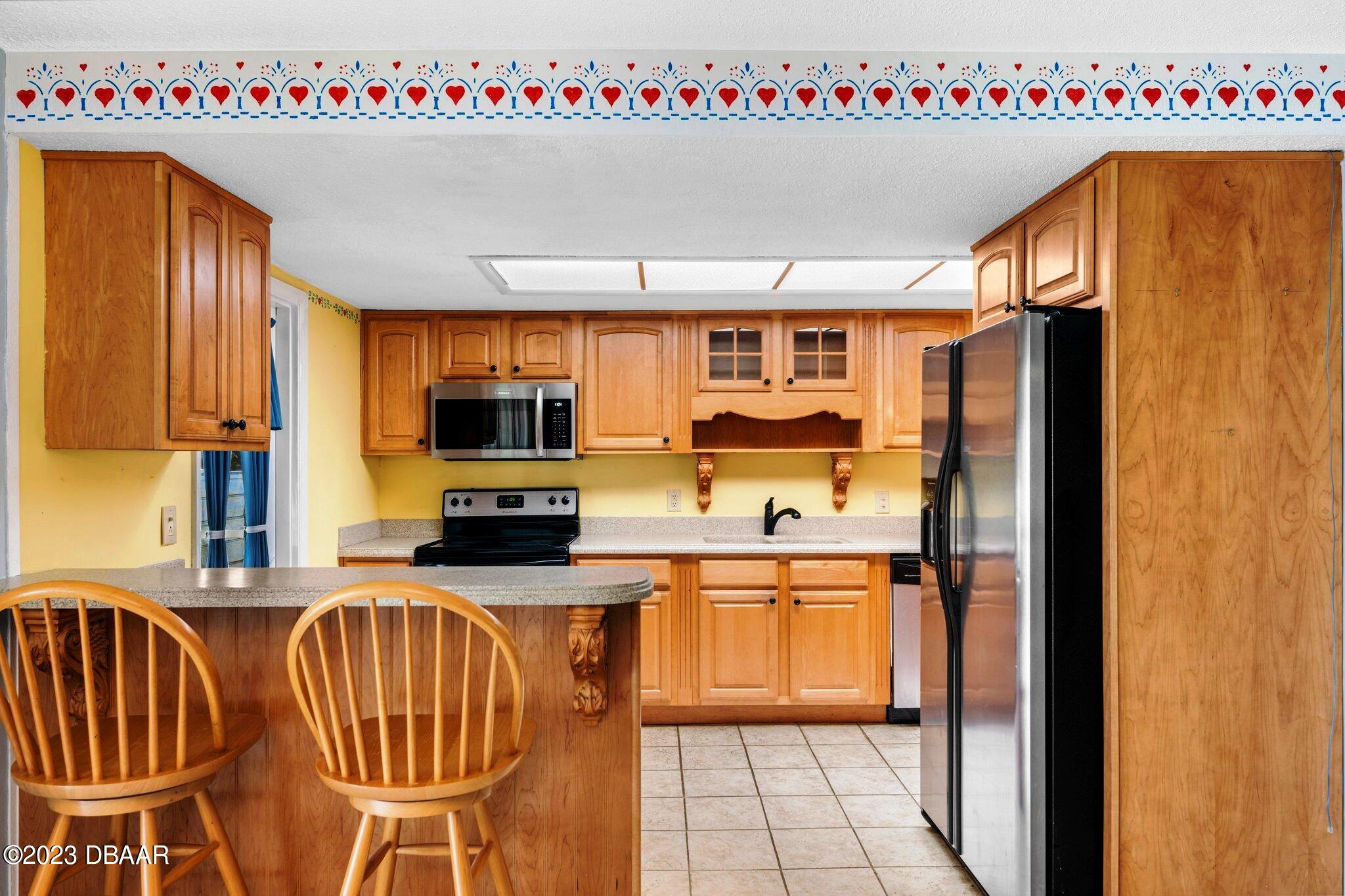 997 Parkwood Drive Ormond Beach, FL 32174 - Photo 3 of 25 997 Parkwood kitchen bar to kitchen