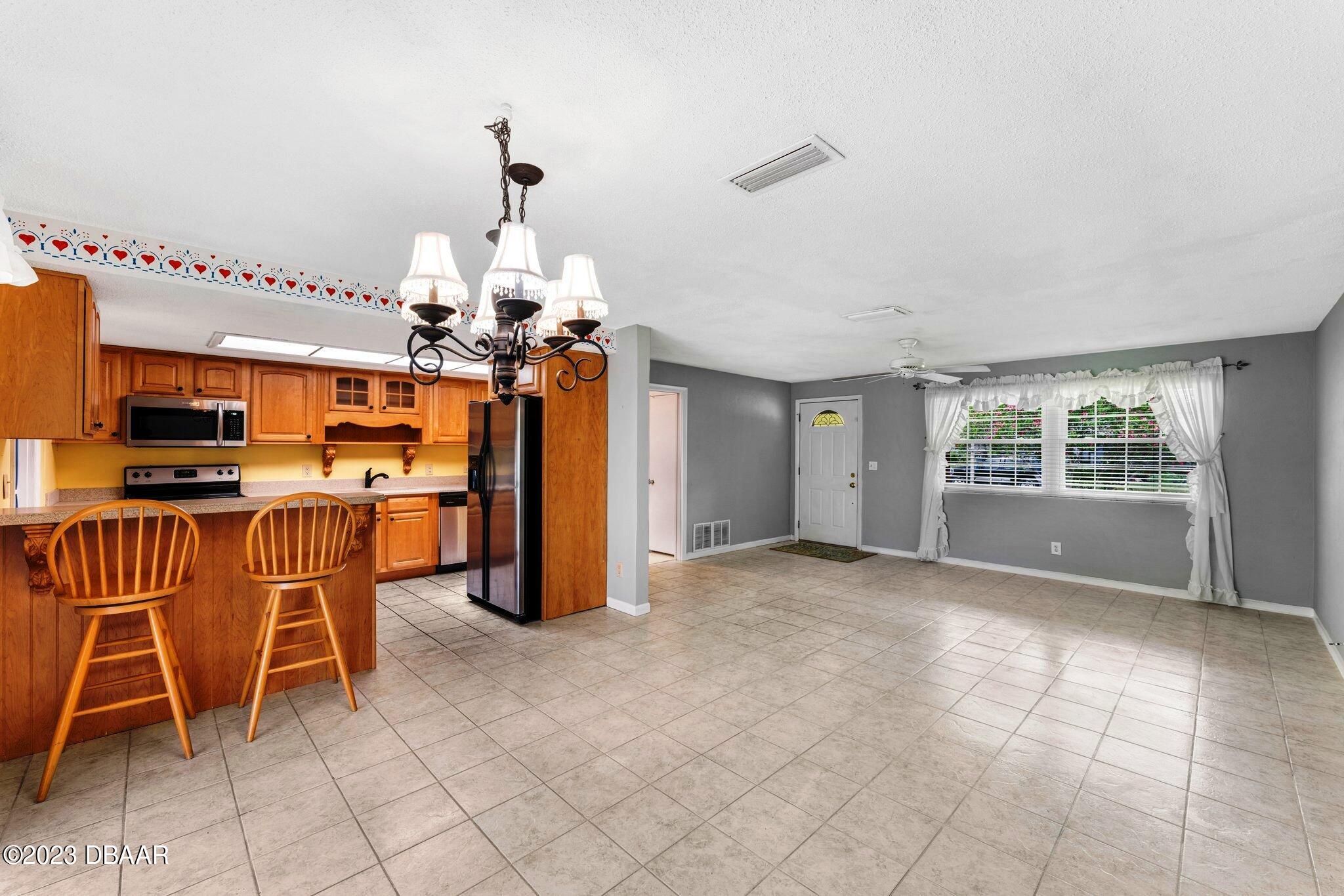997 Parkwood Drive Ormond Beach, FL 32174 - Photo 8 of 25 997 Parkwood dining living area