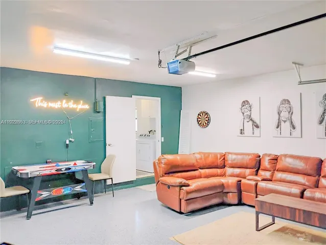 a bathroom with a granite countertop sink and a