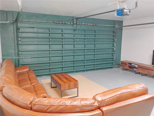 a bedroom with two beds and a large window