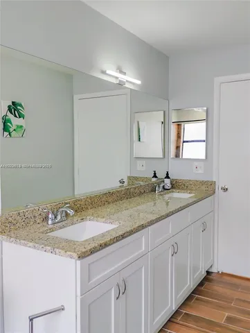 a view of a backyard with table and chairs