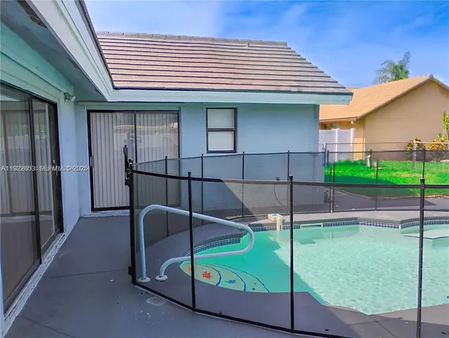 a view of a tall brick building with large windows