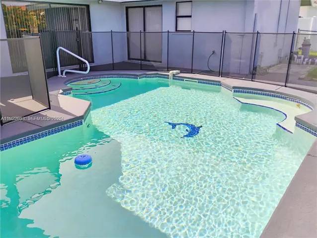 a view of a garden with large trees