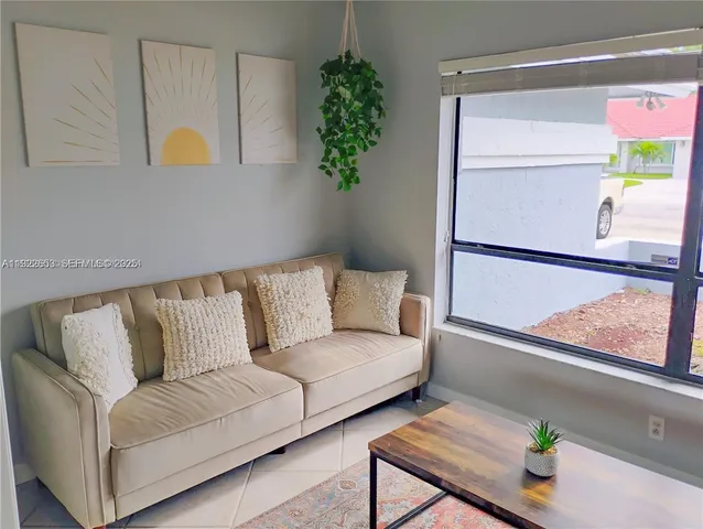 a view of an empty room and a window