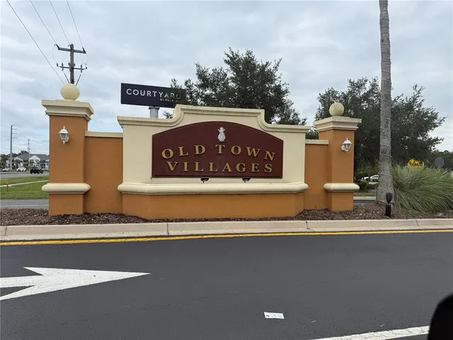 a sign on the side of a street