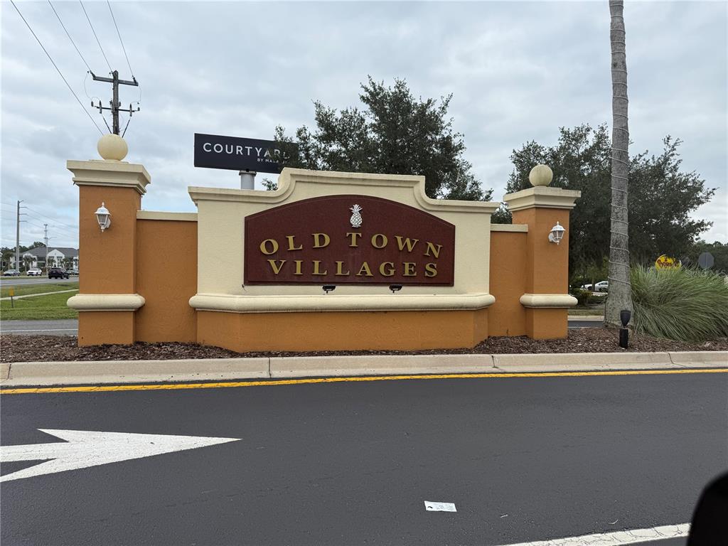 a sign on the side of a street