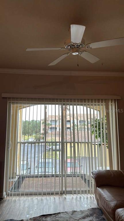 260 Old Village Center Circle, Unit 8205 St. Augustine, FL 32084 - Photo 3 of 13 a living room with furniture and a floor to ceiling window